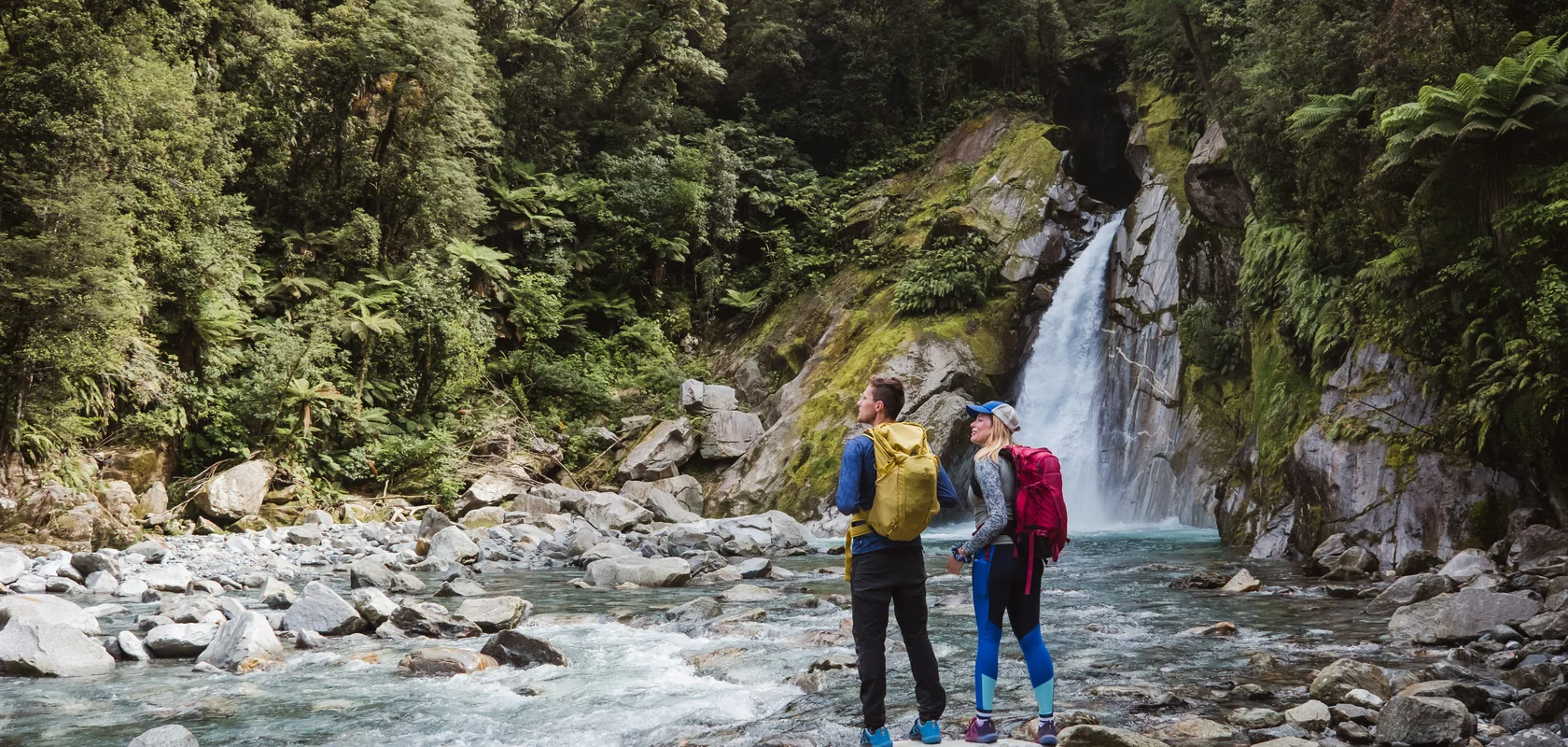 Hikers at Giant Gate Falls, Milford Track