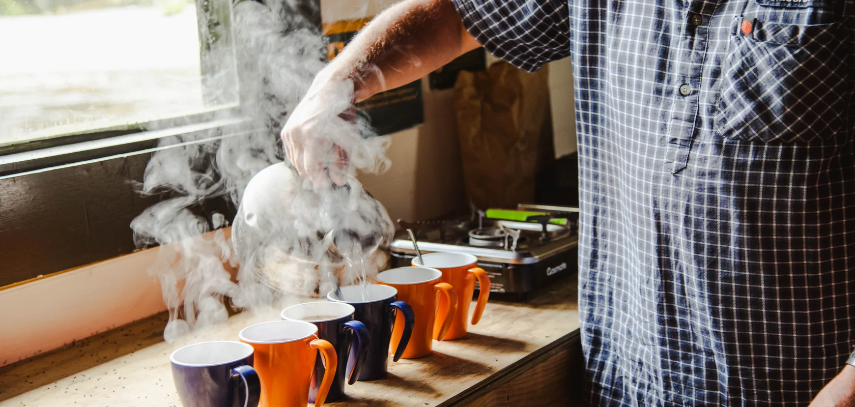 Cup of hot tea at Lake Hankinson Hut on the Guided day tour with Fiordland Outdoors