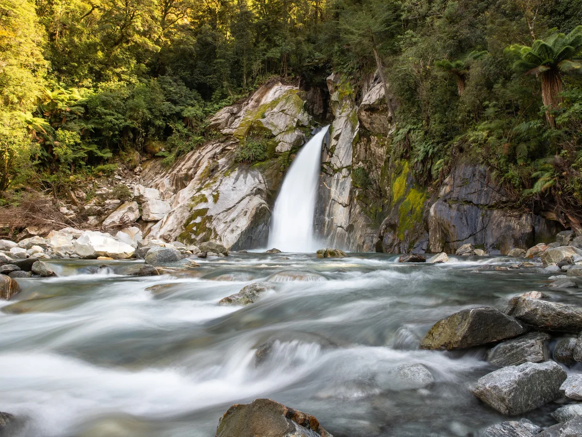 Waterfall on Milford Track day walk with Fiordland Outdoors