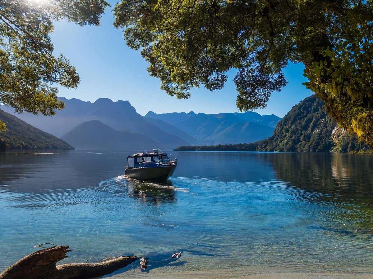 Water taxi pulling up on Lake Te Anau, Fiordland Outdoors Co