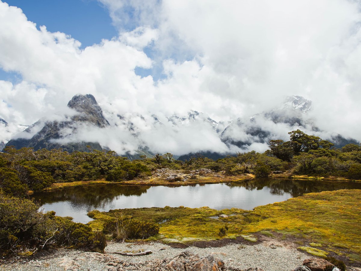 Mirror image of moody skies, On the Routeburn Track New Zealand, Fiordland Outdoors Co